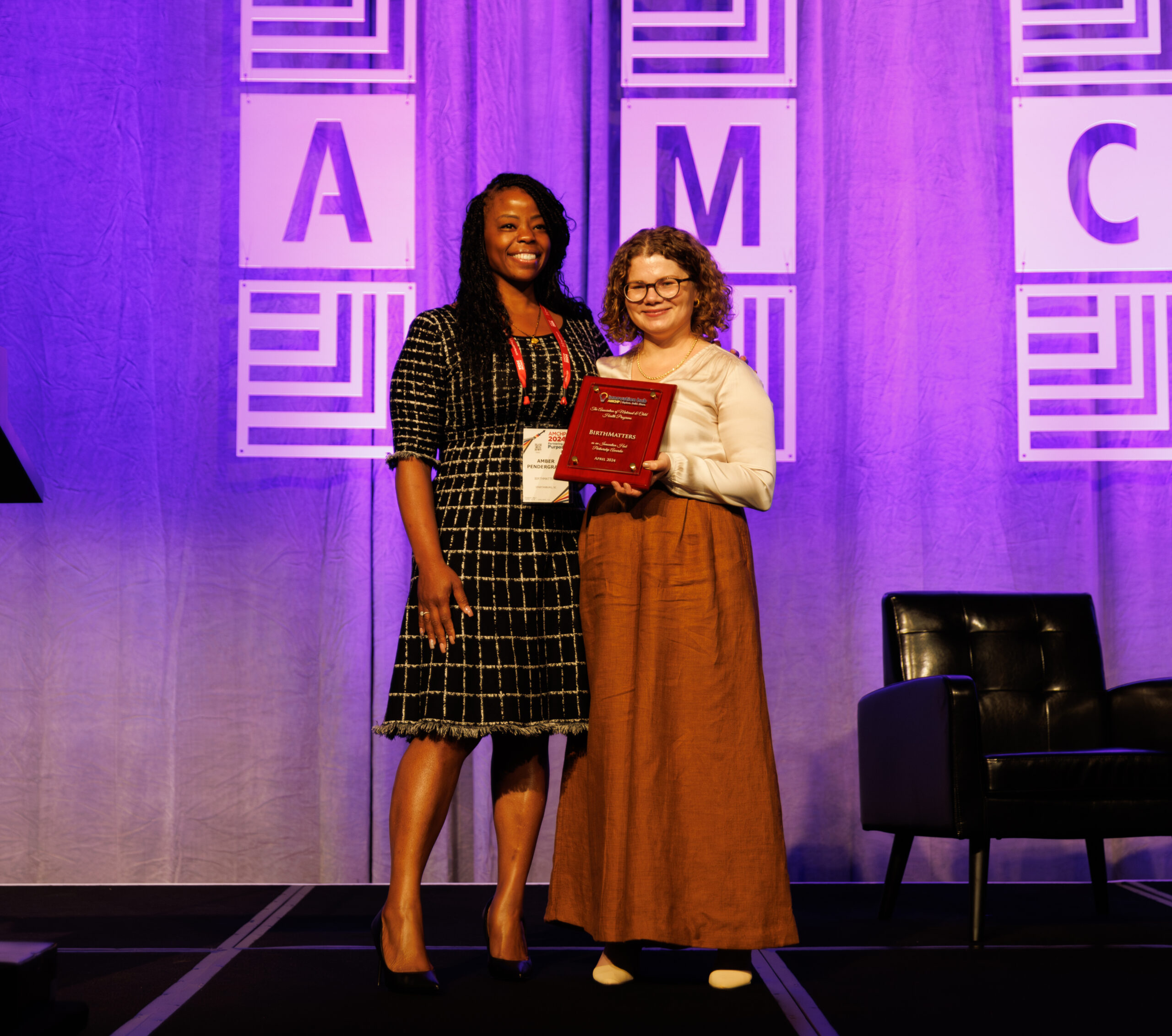 Amber Pendergraph-Leak accepting her Innovation Hub Partnership Award at the 2024 AMCHP Annual Conference. The award is presented by Lynda Krisowaty, AMCHP's Associate Director of Evidence and Implementation.