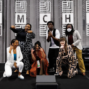 A group of young presenters pose and smile on the stage of the 2024 AMCHP Annual Conference in Oakland, CA.