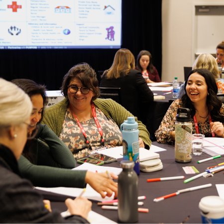 Participants at AMCHP 2024 engaging with each other. 