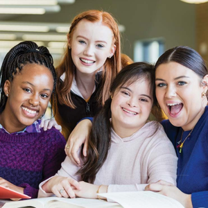 Four young girls smiling