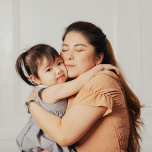 Mother and daughter hugging