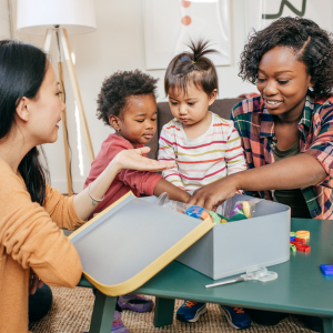 Two mothers playing with their children