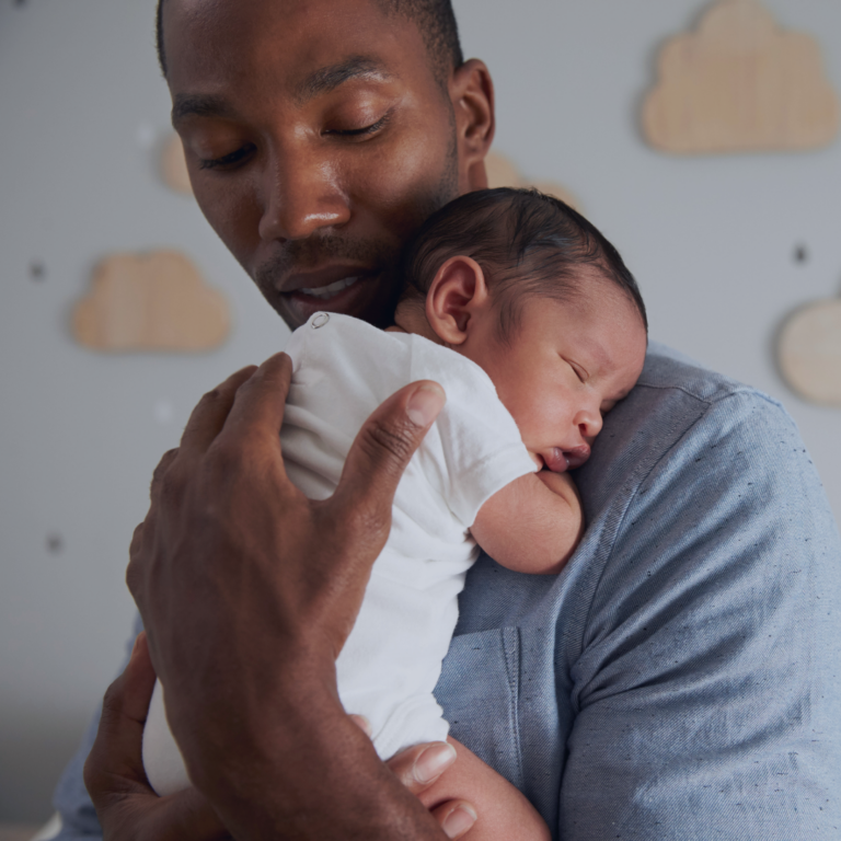 Father holding inant